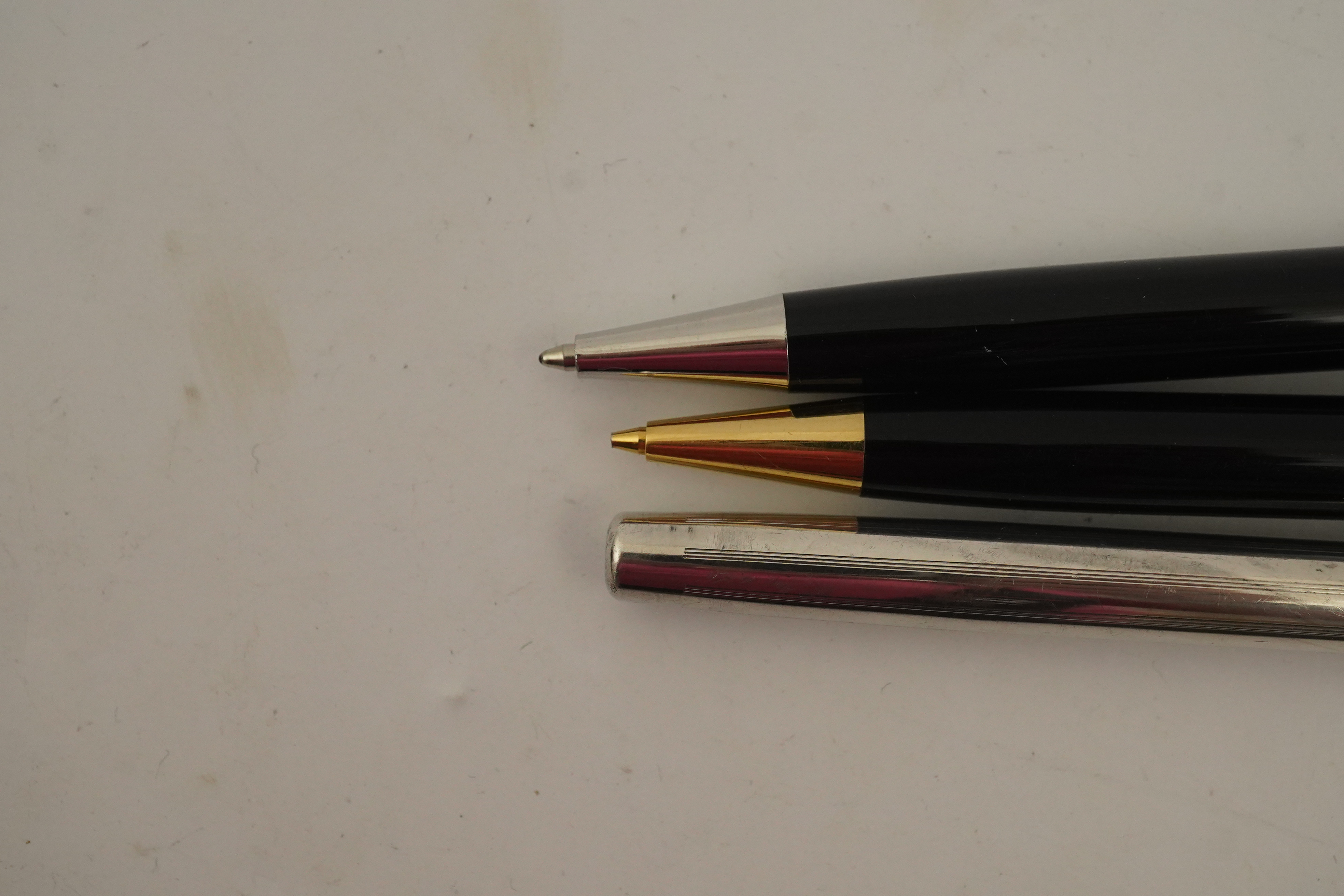 A Montblanc ballpoint pen, a Montblanc pencil and a Cross fountain pen